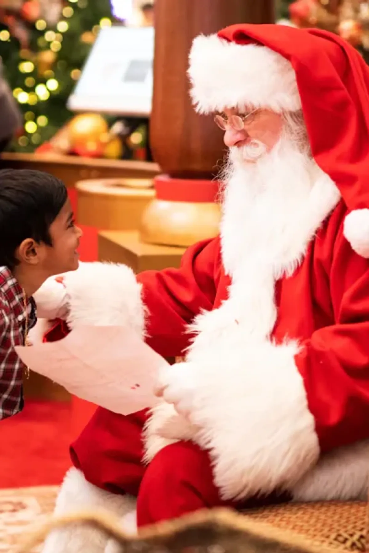 Santa Claus greeting a young guest